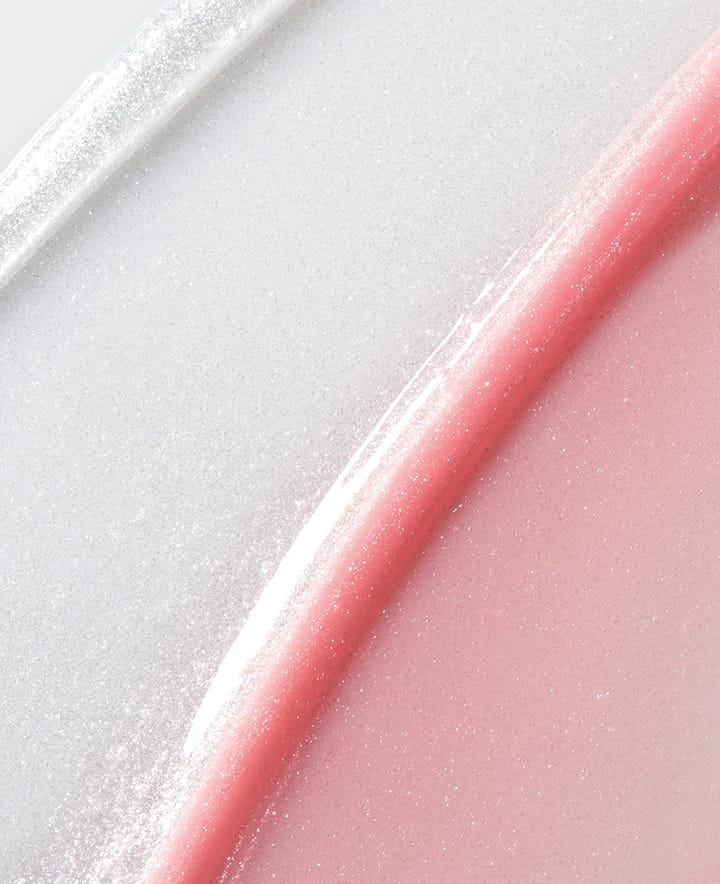 은은한 펄감이 돋보이는 핑크빛과 은은한 광채의 립글로우 발색으로 입술에 촉촉하고 화려한 광채를 더해주는 라네즈 립글로우 밤 스타더스트 에디션의 질감을 보여줍니다.